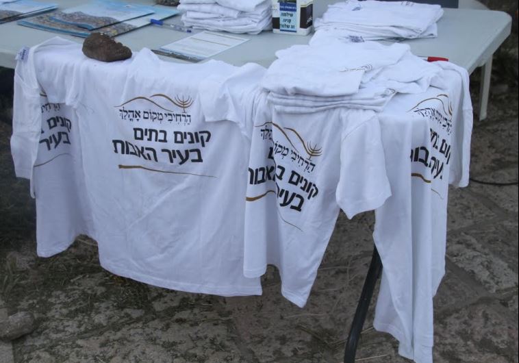 T-shirts with the slogan, "Buying homes in the city of our forefathers." 