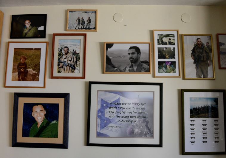 The wall. The house is coveredin photos but this wall is dedicated only to Uriel and Eliraz.