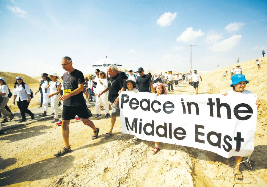 Demonstrators including Israeli and Palestinian activists take part in a demonstration in support of peace near Jericho last year. Credit: Reuters